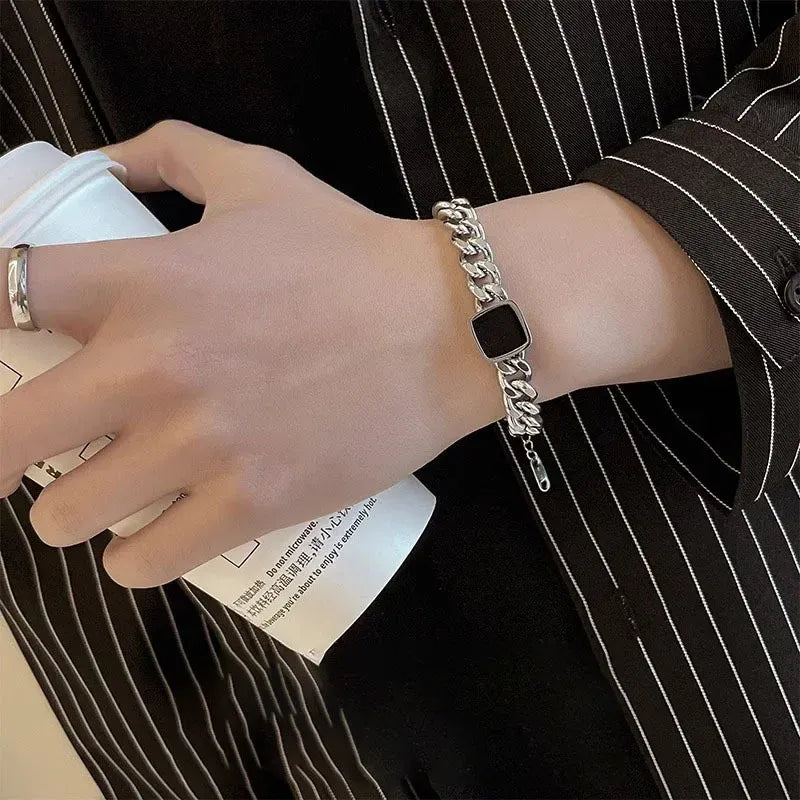 Close up of the unique square link detail and secure clasp on the tarnish-proof Titanium Steel couple bracelet.